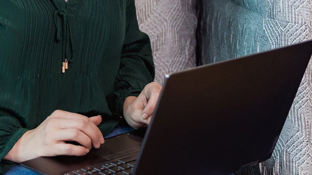 Two people looking at a computer