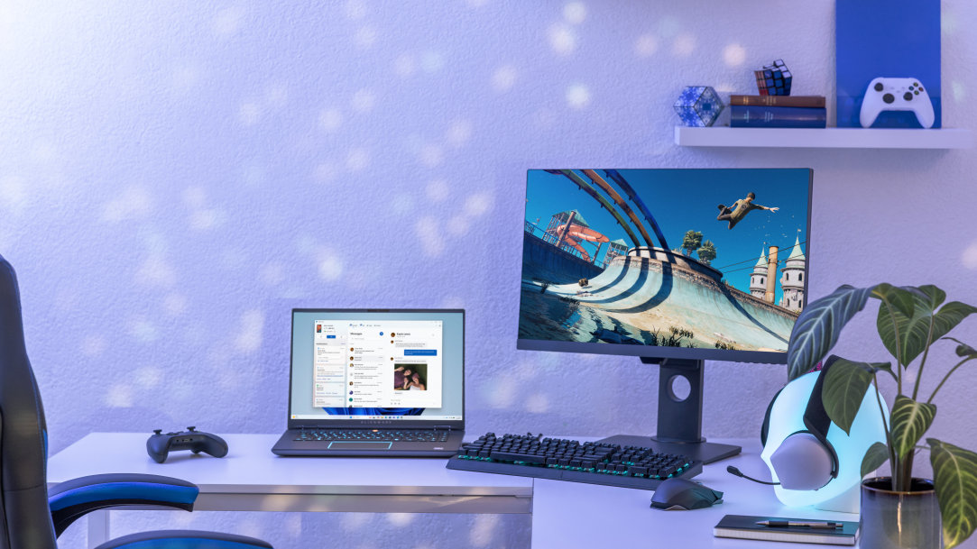 Windows 11 gamer room with laptop, monitor, gaming keyboard and Xbox controller 