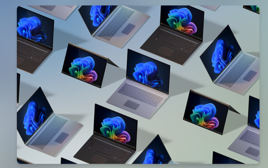 Multiple laptops and two-in-one devices displaying the Windows 11 start screen 