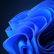 Windows background display of an abstract design of royal blue ribbons on a midnight blue gradient background