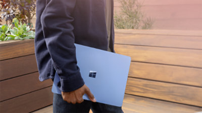 Windows 11 user carrying a new PC