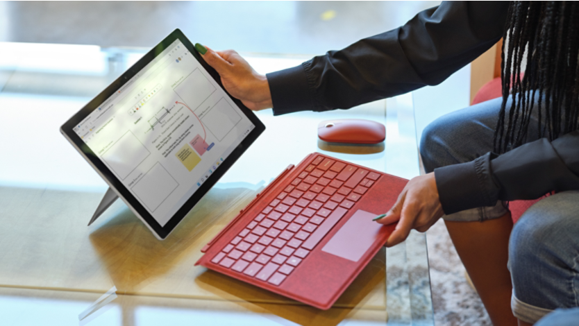 Woman adding Surface Pro Signature Keyboard to her device