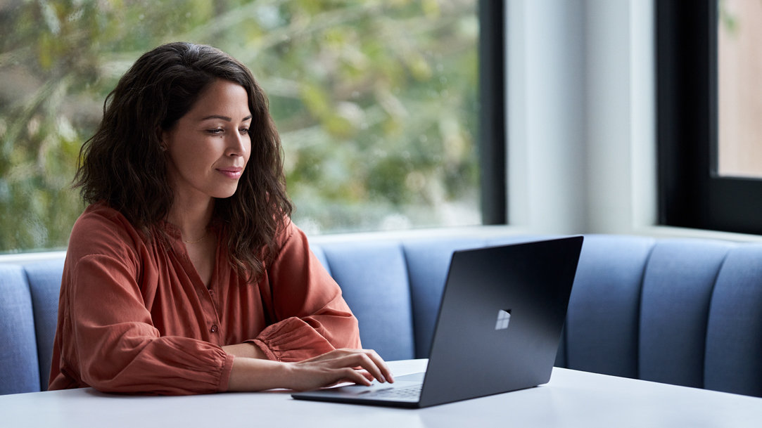 Woman typing on her computer