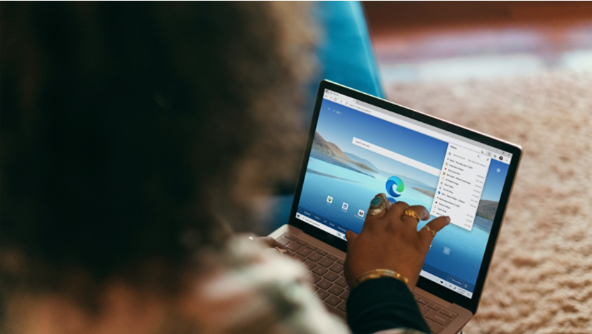 Woman using Microsoft Edge on laptop