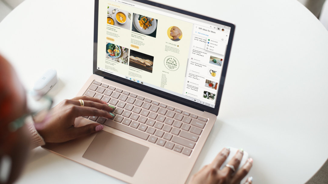 Woman using Surface and Microsoft Edge on white table