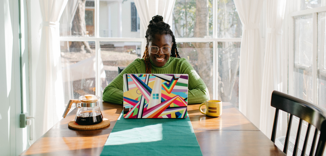 Woman using laptop at table