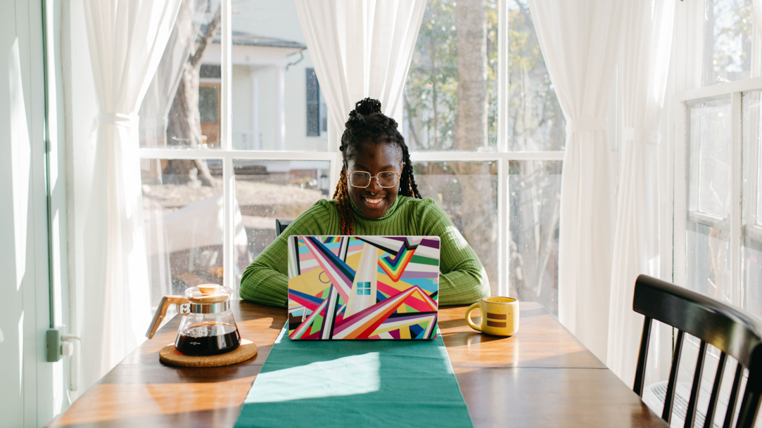 Woman using laptop at table