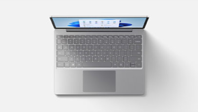 A top-down view of Surface Laptop Go 2 in Ice Blue features the keyboard.
