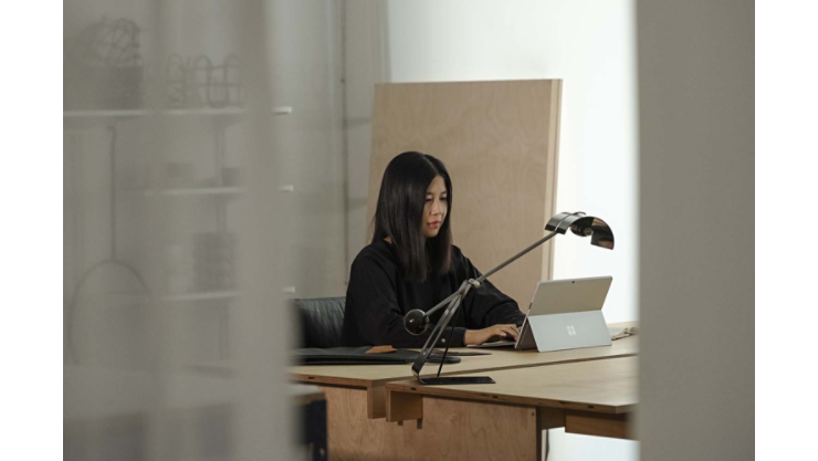 A woman writes with Surface Pen on a Surface tablet