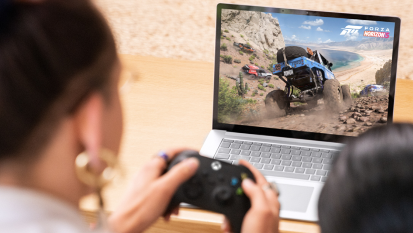 people playing Xbox games on a Surface Laptop 5
