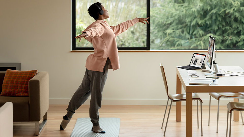 A person using Surface Pro 7+ to dance in their living room.