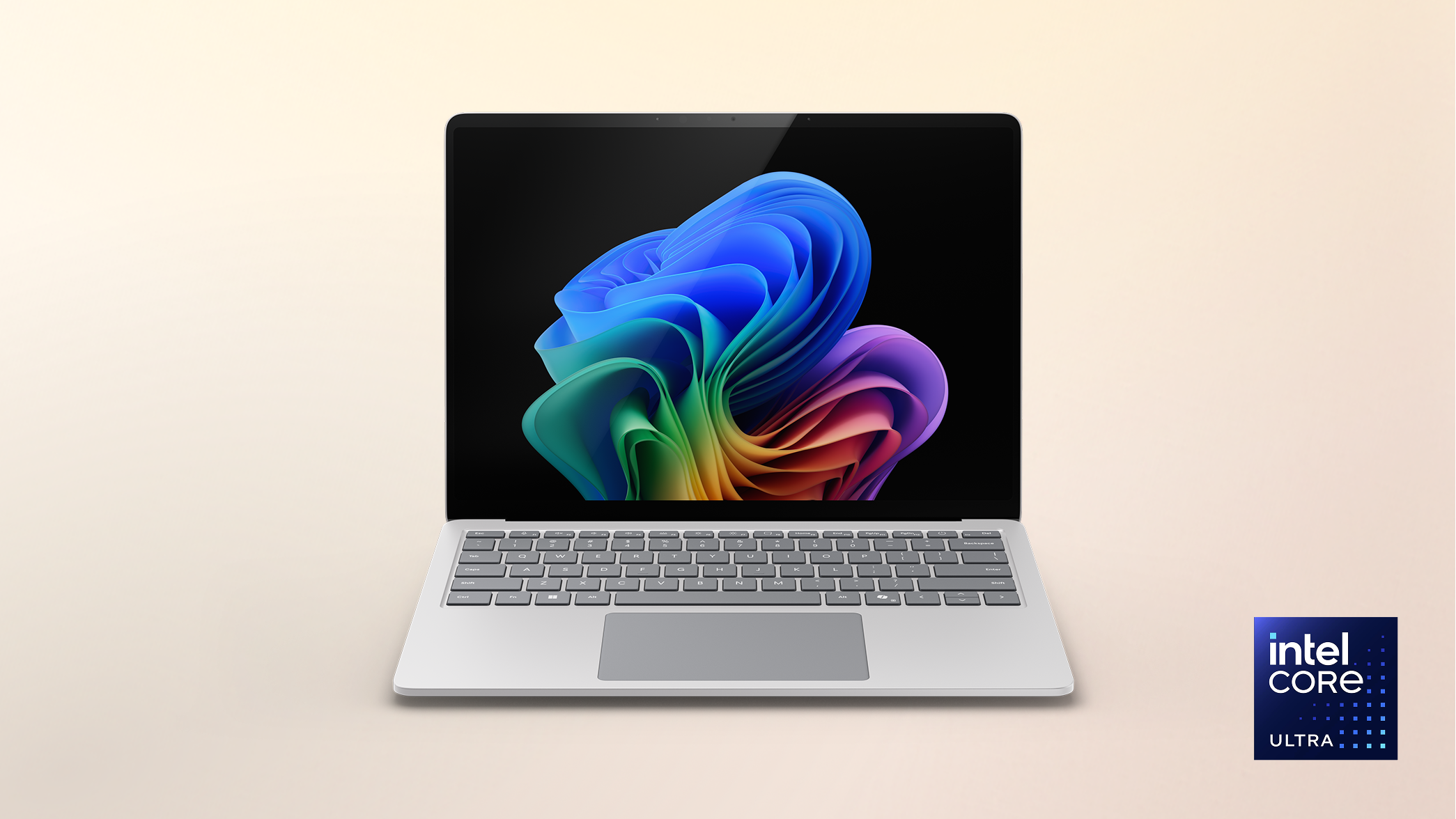 Surface Laptop Copilot+ PC Intel on a peach gradient background