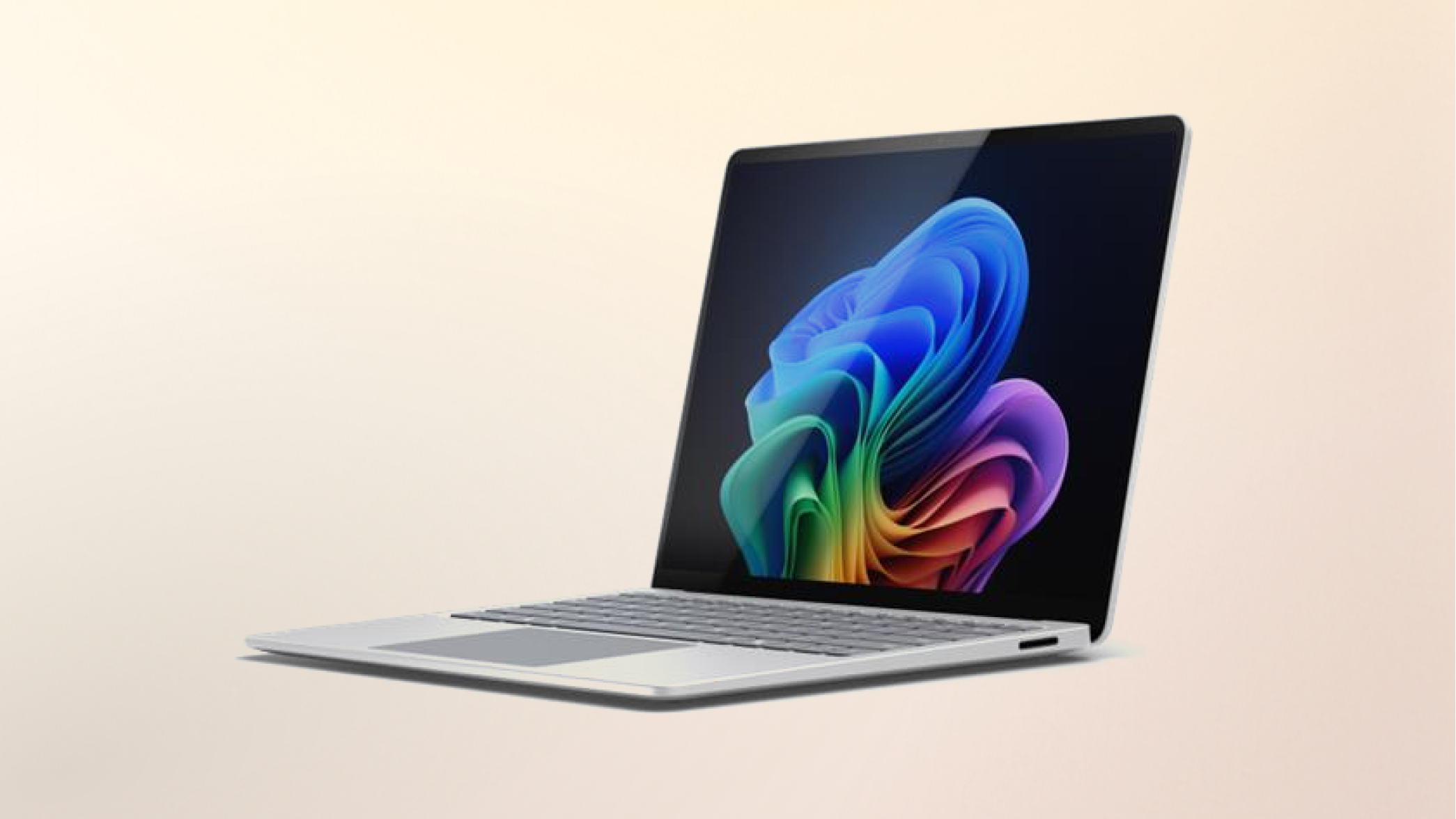 Surface Laptop Copilot+ PC Snapdragon on a peach gradient background