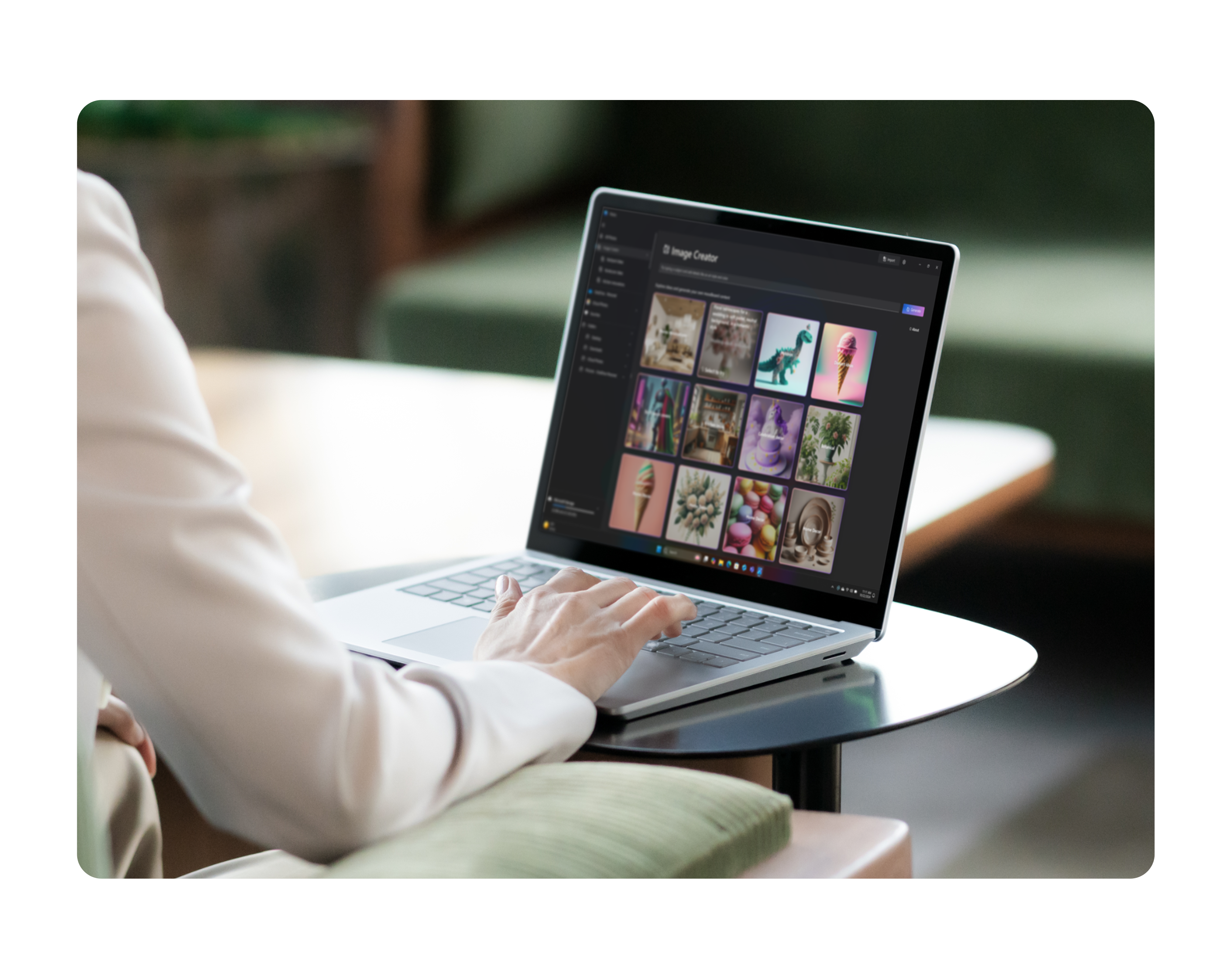 Person sitting at a desk with an open Copilot+ PC showing an image library 
