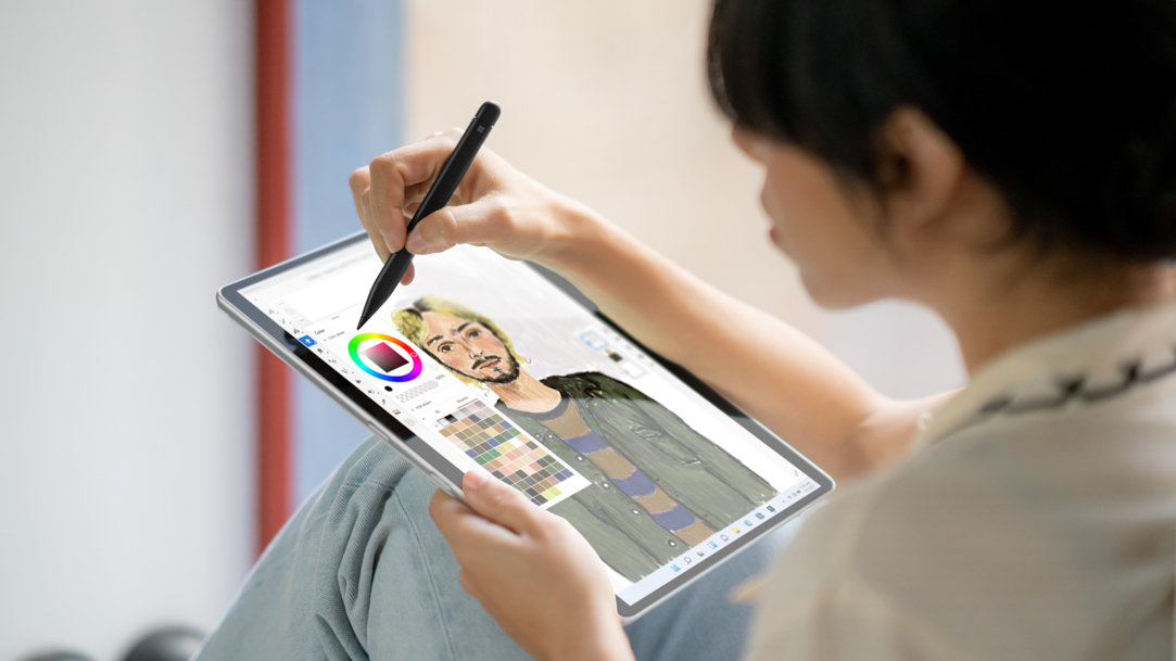 woman sketching with a Slim Pen 2 on a Microsoft Surface device