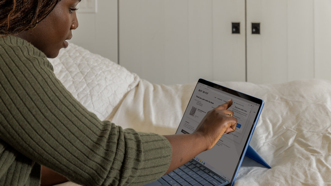 A woman using browser extensions on her Surface device