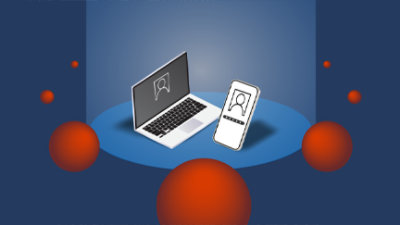 A computer and phone on a table