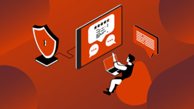 Persoană care stă într-un fotoliu puf cu un computer și un laptop