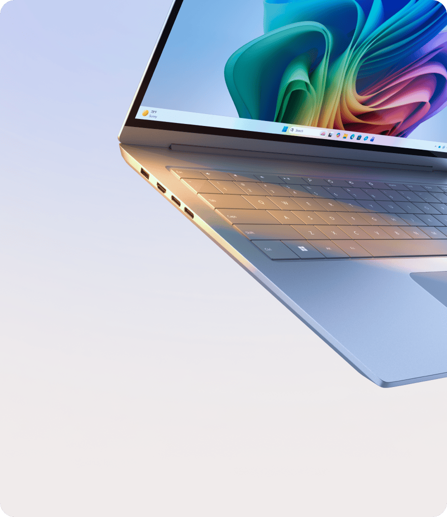 Angled view of an open laptop with the Copilot bloom screen