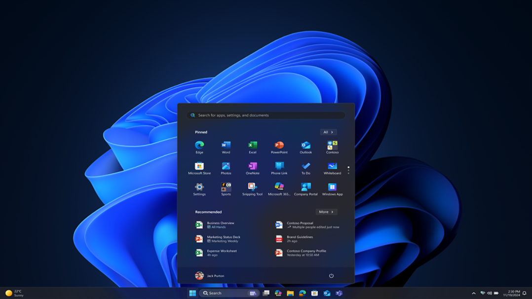 Windows 11 desktop with Start menu open displaying pinned applications and recommended items against a blue abstract background