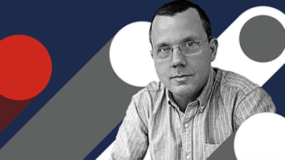 A person wearing glasses and a striped shirt