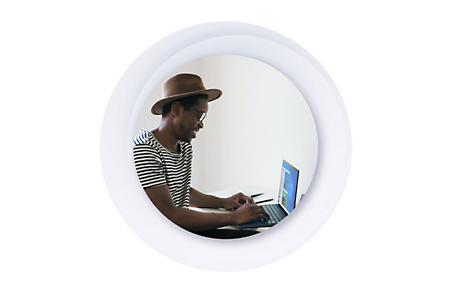 Person in a hat using a laptop