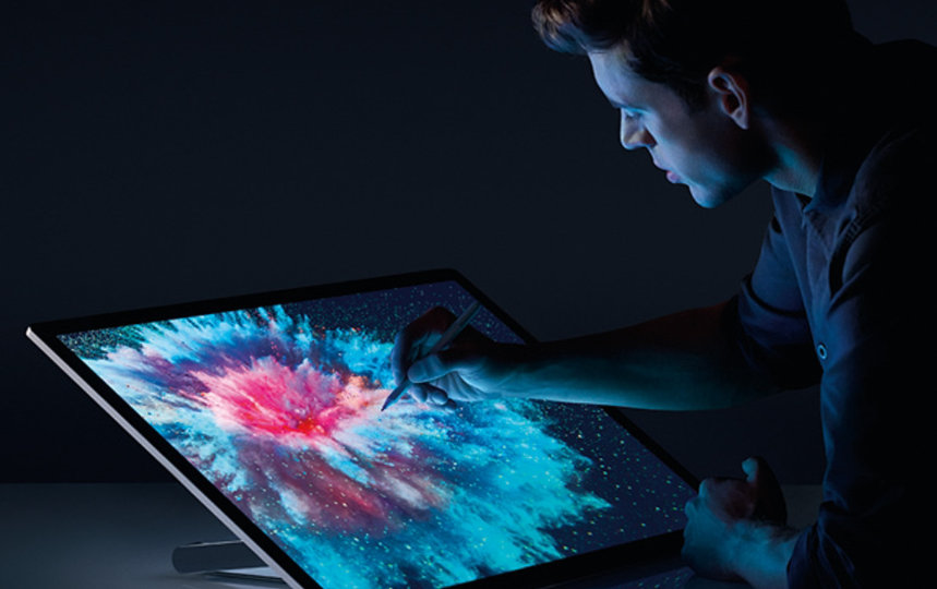 A man draws on Studio 2 in a reclined position.