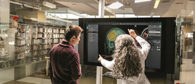 A group of people looking at a computer screen