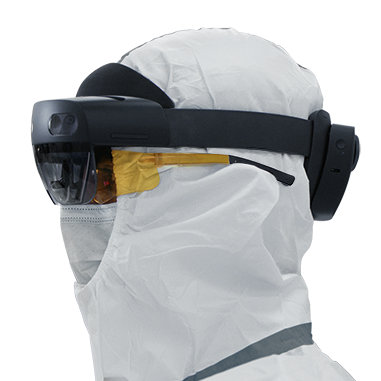 A person in protective gear wearing HoloLens 2.