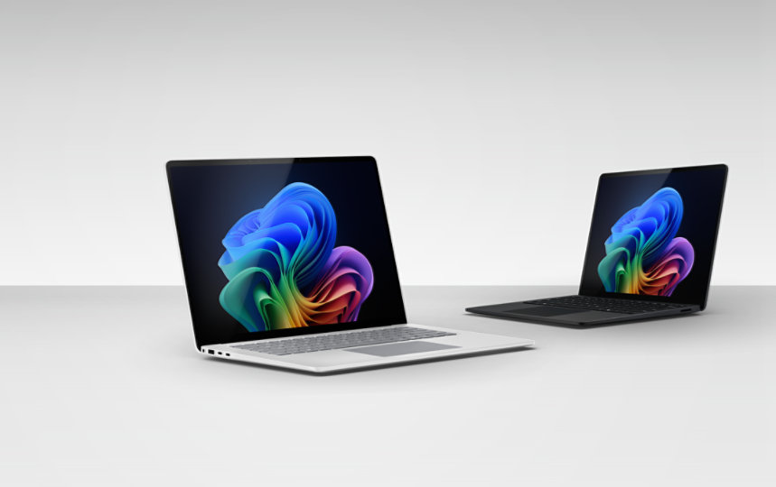 A 15-inch Surface Laptop for Business in the color Platinum beside a 13.8-inch Surface Laptop for Business in the color Black. 