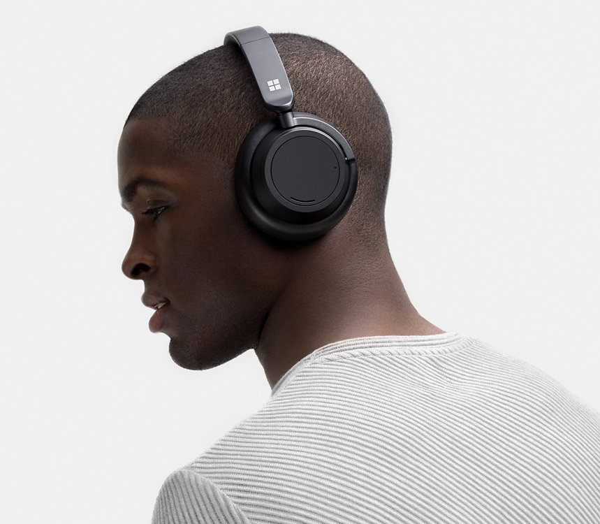 A person wears Surface Headphones 2