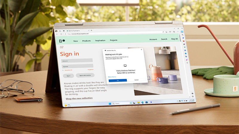PC folded open with a sign-in screen