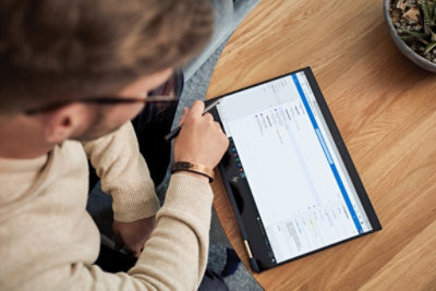 A person using a pen and tablet to review flagged emails in To Do.
