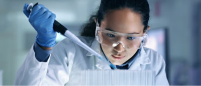 Female scientist performing experiment