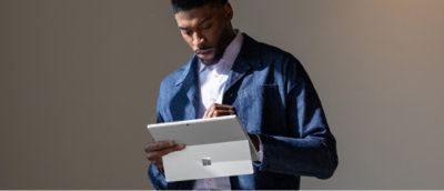 A person holding a tablet.