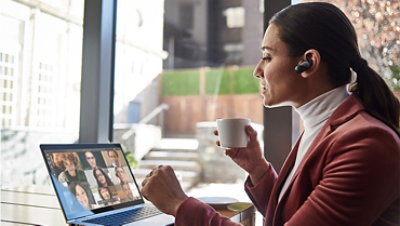 Female small business executive using HP Elite device running Microsoft Teams conference call