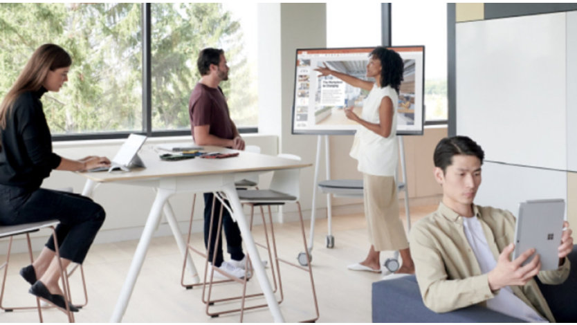 Group of professionals working on a variety of devices