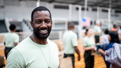 Smiling man at a disaster relief center.