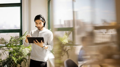 A man holding a tablet.