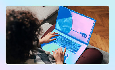 Person working remotely on a laptop from a comfortable home environment