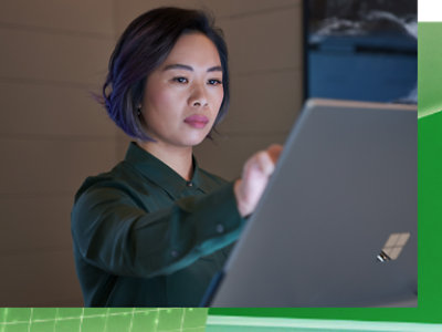 A woman working on surface pro using her hand