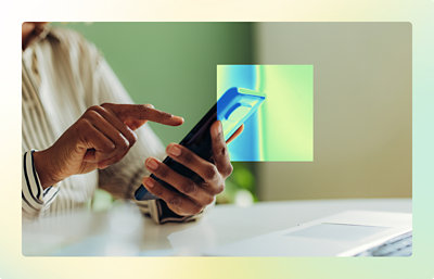 A close-up of a hand holding a phone.