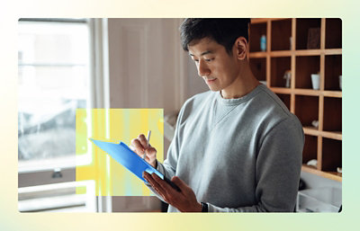 A person holding a tablet and pen.