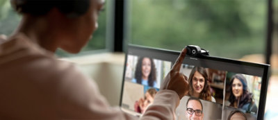 A person using a webcam to talk to a group of people