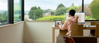 A laptop with a tax screen and a tablet with tax email