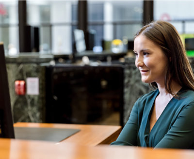 A woman sitting in an office