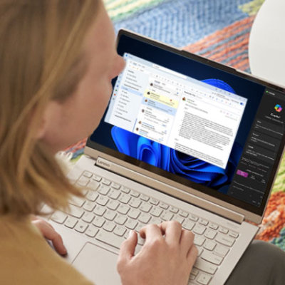 A girl sitting in front of laptop.