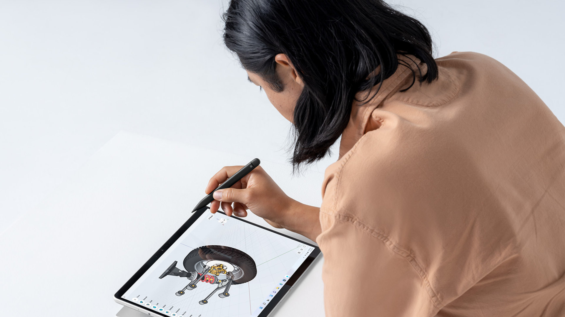A person using Surface Pro 8 and Surface Slim Pen 2 to design.