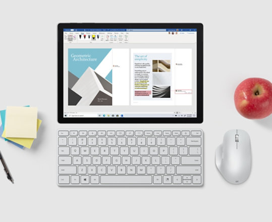 Microsoft Designer Compact Keyboard paired with a tablet and mouse.