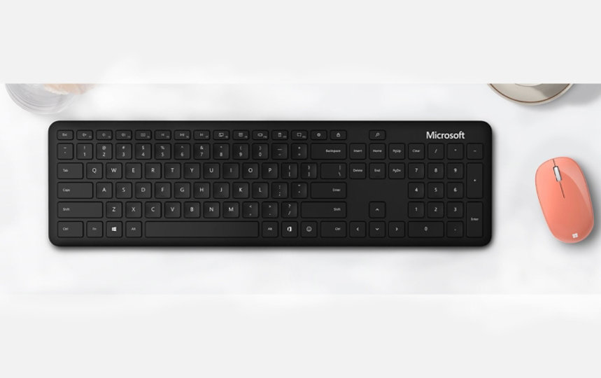 Microsoft Bluetooth Keyboard and mouse on a desk.